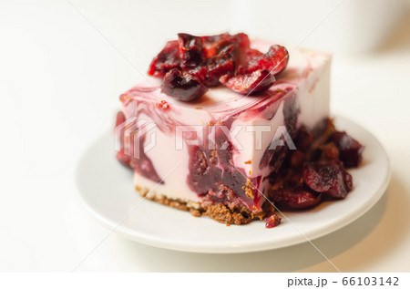 Japanese cheesecake with cherry sauce and fresh Japanese cheesecake with cherry sauce and fresh 66103142