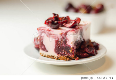 Japanese cheesecake with cherry sauce and fresh Japanese cheesecake with cherry sauce and fresh 66103143