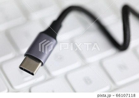 Close up, on computer keyboard cord with adapter Close up, on computer keyboard cord with adapter 66107118