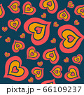 The seamless pattern consists of many multi-colored hearts embedded in each other on a dark blue background 66109237