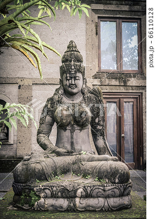 Traditional balinese stone sculpture of a woman in Traditional balinese stone sculpture of a woman in 66110128