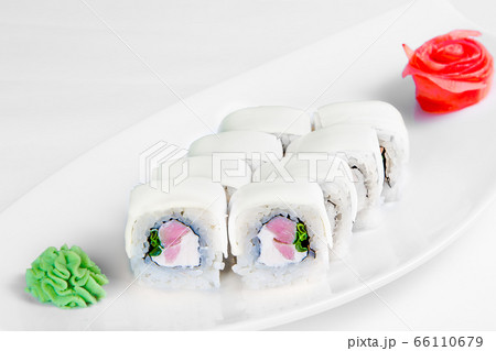 A roll of sushi on a plate A roll of sushi on a plate 66110679