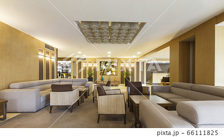 Interior lobby of modern hotel with big gray sofas Interior lobby of modern hotel with big gray sofas 66111825