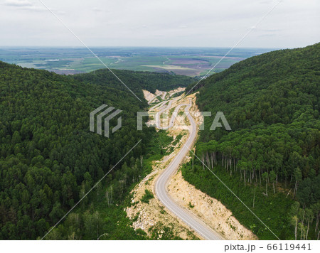 Aerial top vew of winding road in the mountains Aerial top vew of winding road in the mountains 66119441