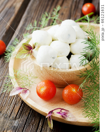 Beads of mozzarella cheese, with greens and 66121631