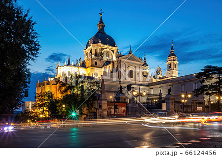 Cathedral of Saint Mary the Royal of La Almudena in center of Madrid at night. View from the crossroad with car lights Cathedral of Saint Mary the Royal of La Almudena in center of Madrid at night. View from the crossroad with car lights 66124456