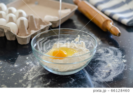 Woman is preparing dough Woman is preparing dough 66128460