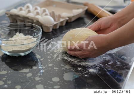 Woman hands preparing dough Woman hands preparing dough 66128461