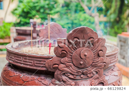 Buddhist prayer sticks inside temple 66129824