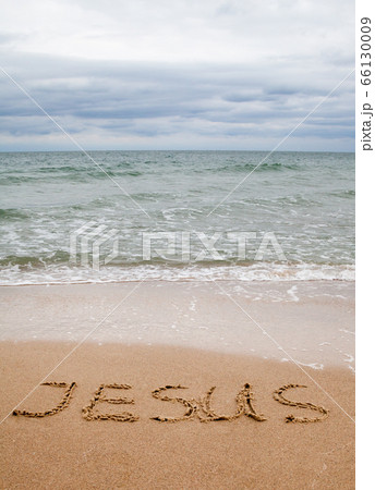 Word Jesus written on the sand 66130009