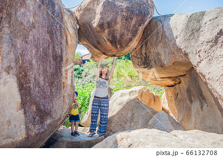 Mother and son travelers at the Hon Chong cape, Garden stone, popular tourist destinations at Nha Trang. Vietnam 66132708