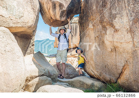 Father and son travelers at the Hon Chong cape, Garden stone, popular tourist destinations at Nha Trang. Vietnam 66132866