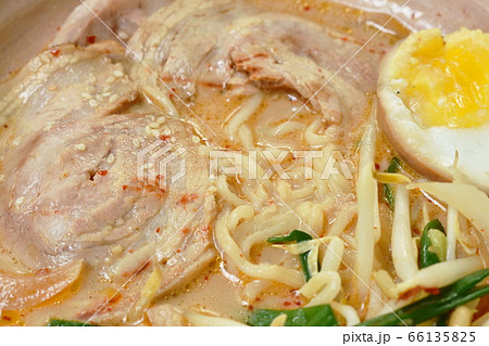 miso ramen or Japanese yellow noodles topping slice braised pork in soybean soup on bowl miso ramen or Japanese yellow noodles topping slice braised pork in soybean soup on bowl 66135825