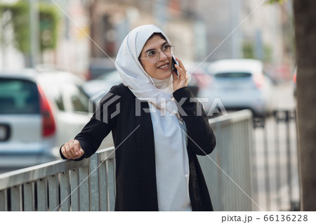 Beautiful muslim successful businesswoman portrait, confident happy CEO 66136228