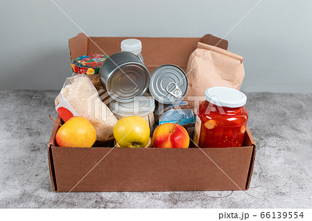 Donation paper bag food supplies for people in isolation on gray background. 66139554