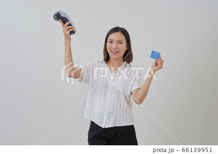 Thai woman presenting credit card for making 66139951