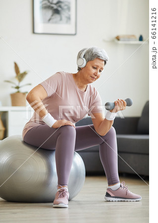 Senior woman exercising with dumbbells Senior woman exercising with dumbbells 66141216