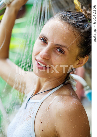 beautiful girl takes a shower on the beach beautiful girl takes a shower on the beach 66142306