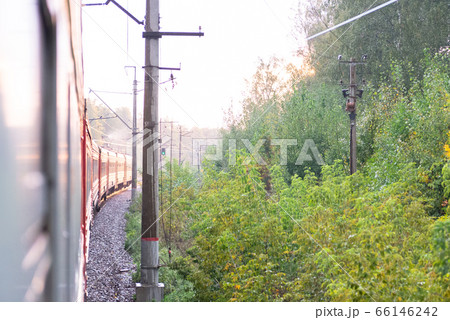 An electric locomotive. The train takes me in the morning. Railway tracks curve. An electric locomotive. The train takes me in the morning. Railway tracks curve. 66146242