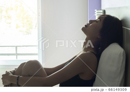 Woman Suffering From Depression On Bed Woman Suffering From Depression On Bed 66149309