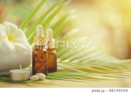 Essential oils bottle with towel and candle Essential oils bottle with towel and candle 66149509