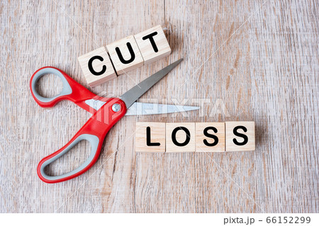 Cut Loss wooden cube blocks and Scissors on table Cut Loss wooden cube blocks and Scissors on table 66152299
