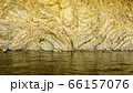 Texture of sea water and relief hard rock wall 66157076
