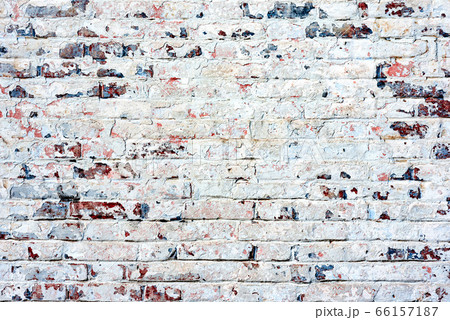 Texture of a brick wall with cracks and scratches 66157187