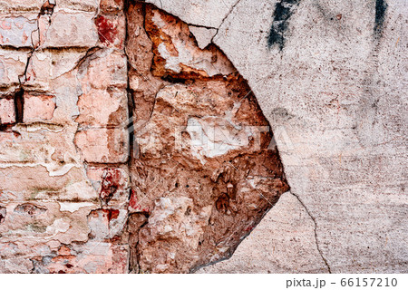 Texture of a brick wall with cracks and scratches Texture of a brick wall with cracks and scratches 66157210
