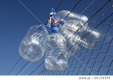 Empty wet plastic water bottles  66158399