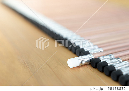 Wooden pencils with black eraser place on Wood background And Close Up, One pencil singled out Wooden pencils with black eraser place on Wood background And Close Up, One pencil singled out 66158832