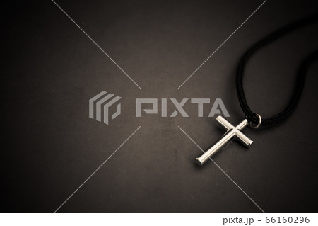 metal cross on black table. religion concept. 66160296