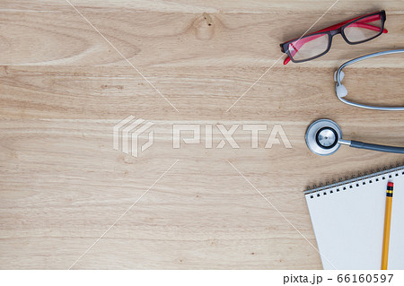 Doctor tool stethoscope on table background Doctor tool stethoscope on table background 66160597