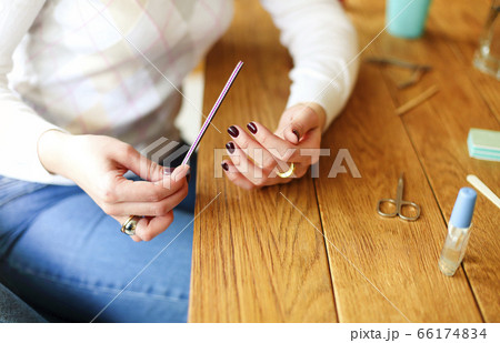 Woman making manicure at home Woman making manicure at home 66174834