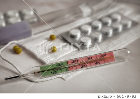 The thermometer shows an elevated temperature for a coronavirus infection The thermometer shows an elevated temperature for a coronavirus infection 66179792