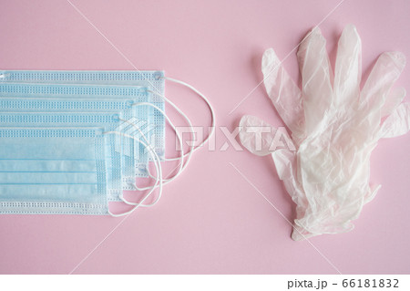 Medical protective mask and rubber gloves lie on a blue background. Anti-virus protection kit against covid-19. Coronavirus pandemic 2019. Medical protective mask and rubber gloves lie on a blue background. Anti-virus protection kit against covid-19. Coronavirus pandemic 2019. 66181832