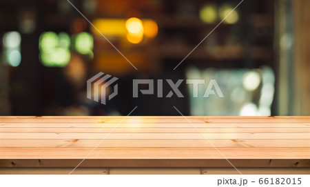 Empty wooden table top on abstract blur background Empty wooden table top on abstract blur background 66182015