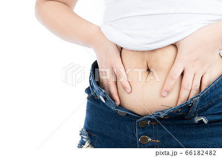 Fat woman holding excessive fat belly, overweight 66182482