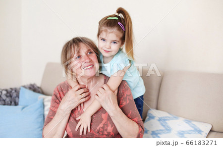 Happy woman with little girl at home 66183271