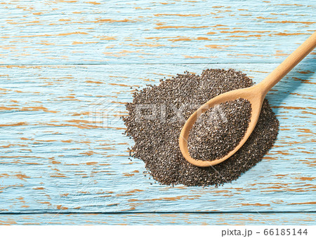 raw seeds of chia seeds in a wooden spoon on a 66185144