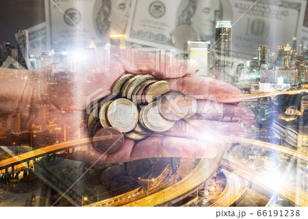 double exposure of businessman holding coin in 66191238