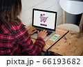 Online shopping website on laptop screen with 66193682