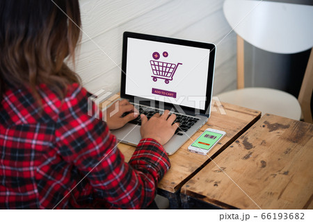 Online shopping website on laptop screen with 66193682