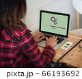 Woman settings electronic on her device. Network 66193692