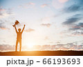 Silhouettes of man won a trophy, achieved with his 66193693