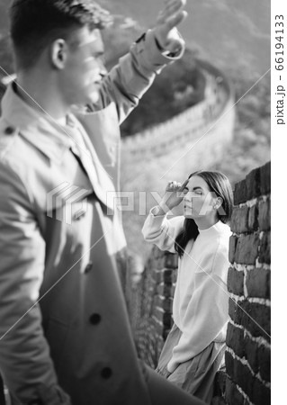 beautiful young couple posing at the Great Wall of China beautiful young couple posing at the Great Wall of China 66194133