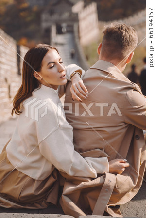 beautiful young couple showing affection on the Great Wall of China beautiful young couple showing affection on the Great Wall of China 66194157