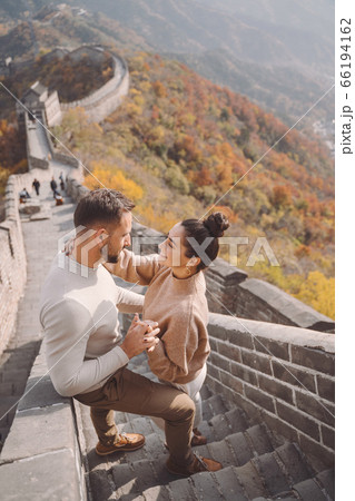 beautiful young couple showing affection on the Great Wall of China beautiful young couple showing affection on the Great Wall of China 66194162
