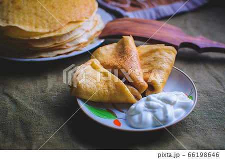 traditional pancakes, homemade pastries with sour cream 66198646