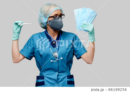 female doctor with stethoscope wearing protective mask and latex gloves over light grey background holding thermometer 66199256